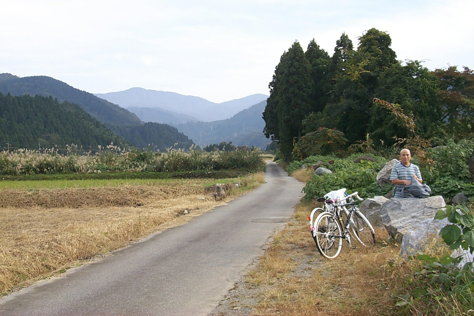 Yasushi Naoe and Kevin Cory cycling in the mountains of Toyama, Japan